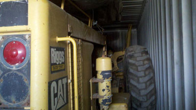 Export Logistics & Shipping, Inc. transports Caterpillar 140G grader internationally by cube container